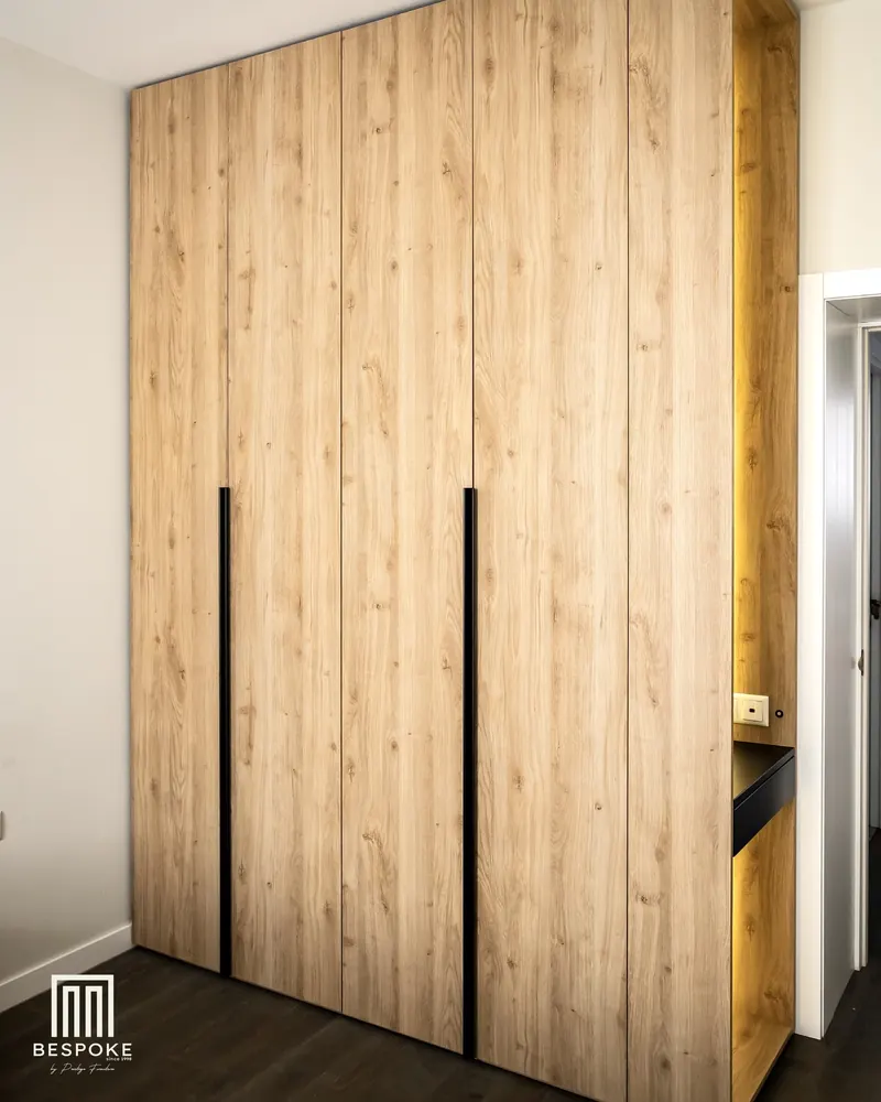 Oak wardrobe doors with full-height black handles